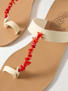 Red Sandals With Single Toe Strap For Beach, Red Beach Sandals With Single Toe Strap, Red Leather Flip Flops For Summer, Red Beaded Sandals For Summer, Red Toe Loop Sandals For Spring, Red T-strap Sandals For Beach And Spring, Red T-strap Sandals For Summer Beach, Red T-strap Sandals For Spring Beach, Red T-strap Sandals For Beach In Spring