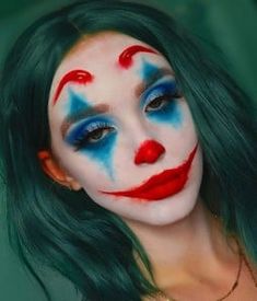 a woman with green hair and makeup is dressed in clown makeup for the photo shoot