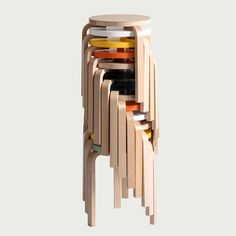 a stack of stools made out of wooden sticks and plastic cups on top of each other