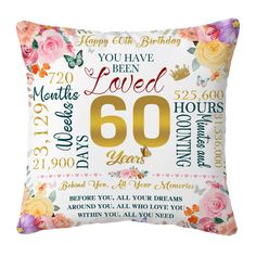 a pillow with the number sixtyth birthday message on it and flowers in gold foil