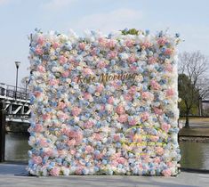 a large floral display on the side of a river