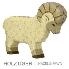 a wooden sheep is shown with the words holtiger and fawn on it