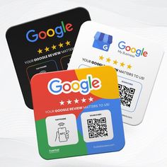 three different google credit cards sitting next to each other