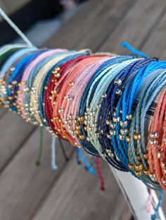 P U R A V I D A B R A C E L E T these pura vida inspired bracelets are made so that you can have a similar bracelet for cheaper! these are durable, so you do not have to worry about the string breaking. these bracelets are waterproof, so you can wear them in the water and are also adjustable, so you do not have to worry about the fit. these bracelets are made extra-long, so that one size can fit all. however, if the ends are too long for your taste, you can simply cut, tie, and burn the ends. ea Bohemian Braided Bracelets With Silver Beads, Adjustable Braided Bracelets With Tiny Beads, Adjustable Braided Bracelet With Tiny Round Beads, Bohemian Silver Beaded Friendship Bracelet, Colorful Beaded Bracelets For Summer Gifts, Adjustable Silver Beaded Bracelets For Beach, Colorful Beaded Bracelets As Summer Gifts, Summer Gift Beaded Bracelets With Round Beads, Summer Friendship Bracelets With Resizable Round Beads