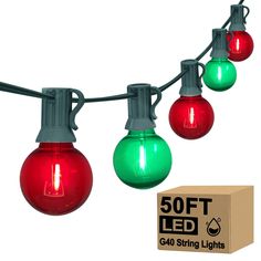 red, green and white christmas lights are hanging on a string with the box next to it