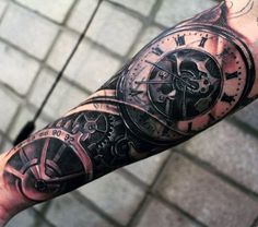 a man's arm with a clock and gears tattoo on the left side of his arm