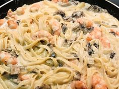 pasta with shrimp and mushrooms in a skillet