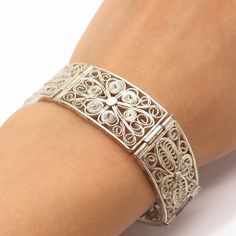 Great antique condition.  925 Sterling Silver Antique Filigree Pael Link Bracelet 7"  Weight: 29.0g   WELCOME TO PAWN SHOP We are an actual pawn shop and have been in business for over 25 years. Since 1990, our establishment has been serving a variety of clients by providing them with short term cash solutions and options of liquidity regarding their treasured heirlooms. Acknowledging that today′s customers are very sophisticated and are looking for a variety of investments, our acquisitions are Classic Silver Bangle With Intricate Design, Classic Sterling Silver Filigree Bracelet Gift, Ornate Sterling Silver Bracelet With Intricate Design For Anniversary, Classic Filigree Bangle Gift, Classic Sterling Silver Bracelet With Filigree, Ornate Sterling Silver Bracelet For Anniversary, Silver Filigree Bangle For Anniversary, Classic Silver Bracelets With Intricate Design, Antique Sterling Silver Bracelets With Intricate Design