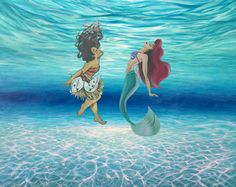 two mermaids are swimming in the ocean together