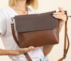 👜This beautiful handmade crossbody soft purse is made of 100% genuine leather. It is tan colour with brown. 👜 This soft eco-tanned leather two colour shoulder bag is very good for everyday use and will keep you comfortable all day long. You can also use it as evening bag. It has three different sizes. Small size is big  enough to fit your esentials like wallet, keys, makeup, phone. Medium size is big enough to fit your iPads. You can put most of your essentials to large size. 🎁This bag can be a wonderful gift for a woman on her birthday, mother's day, anniversary or Christmas. You can buy it as a gift to your friend, wife, girl friend, sister or mother. 👜 This high quality bag has one inside and one outside pockets.  👜  Inside pocket has a zipper. 👜  It has an apparatus for keys so y Brown Crossbody Shoulder Bag For Gift, Brown Crossbody Shoulder Bag As Gift, Gift Brown Crossbody Shoulder Bag, Brown Shoulder Bag With Removable Pouch As Gift, Brown Satchel With Adjustable Strap As Gift, Gift Crossbody Shoulder Bag With Smooth Grain, Gift Smooth Grain Crossbody Shoulder Bag, Soft Leather Cognac Shoulder Bag For Gift, Soft Leather Cognac Shoulder Bag As Gift