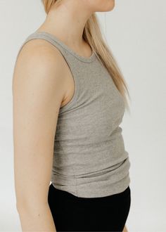 Éterne High Neck Fitted Tank in Heather Grey. Made from a lightweight cotton rib fabric, this tank is both form-fitting and flattering with its high crew neck cut. Perfect for everyday wear, pair it with high-rise jeans or leather pants for a stylish look. Fits true to size, designed for a slim fit Available in Heather Grey 47% cotton, 47% rayon, 6% spandex Machine wash cold. Non-chlorine bleach. Tumble dry low. Cool iron. Do not dry clean. Shop more women's designer leisurewear here. ABOUT ÉTER