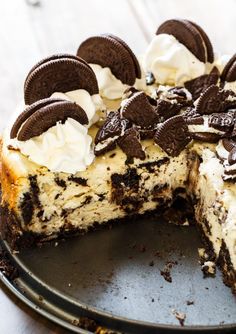 a cheesecake with oreo cookies and cream on top