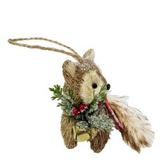 a stuffed animal hanging from a rope with christmas decorations on it's back end