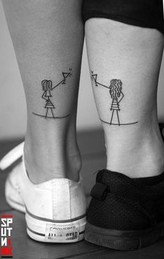 two people with matching tattoos on their legs