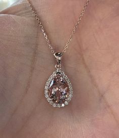 "Beautiful Morganite and Diamond Necklace 14K rose gold pendant. Lays nicely on the neck. Just the perfect size. Genuine pink morganite pear cut 2.80 carats morganite 12x8mm pear morganite Clarity: VS Eye clean stone Genuine earth mined round brilliant cut diamonds 0.38 carats diamonds 18\" 14K Rose Gold necklace Comes with gift box" Luxury Rose Gold Moissanite Necklace, Rose Gold Pear-shaped Gemstone Necklaces, Rose Gold Pear-shaped Gemstone Necklace, Exquisite Pear-shaped Rose Gold Jewelry, Formal Morganite Teardrop Jewelry, Fine Jewelry Pear-shaped Rose Gold Necklace, Fine Jewelry Rose Gold Pear-shaped Necklace, Rose Gold Pear-shaped Fine Jewelry Necklace, Pear-shaped Rose Gold Necklace For Formal Occasions