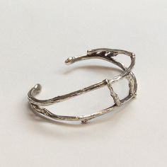 This is a beautiful round and simple sterling silver cuff made of two wires of silver. The texture of the wire are branches and creates an original, different look that would defintely catch the eyes. (code: k#418) It is made to fit a small-average size wrist. Dimensions: Approximate diameter: 6.2 cm Approximate width: 1.8 cm *If, for any reason, you are not completely satisfied, please contact me so we can try to work out the problem. Shipping I ship twice a week. pls allow few days before ship Branch Bracelet, Agate Stone Necklace, Woodland Earrings, Wide Silver Ring, Chunky Silver Rings, Wire Cuff, Casual Necklaces, Natural Gemstone Necklace, Nugget Necklace