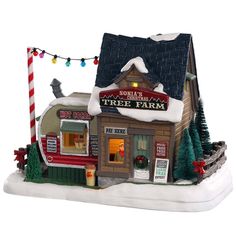 a christmas scene with a tree farm store and candy cane in the foreground, on a white background