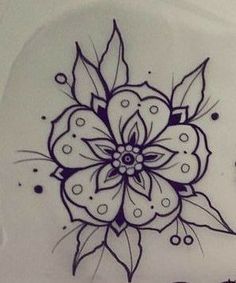 a drawing of a flower on the side of a white toilet bowl with black dots