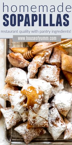 homemade sopapillas with honey and powdered sugar on top in a basket