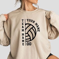 Elevate your volleyball spirit with our Personalized Volleyball Sweatshirt! This custom sweatshirt can be personalized with your team name, player number, and name, making it a perfect choice for both players and proud volleyball moms. Crafted from soft and durable fabric, it's ideal for keeping warm during games or practices. Whether you're cheering from the stands or gifting it to a fellow volleyball enthusiast, this sweatshirt is a stylish way to show your support for the team! ✨ K E Y * D E Collegiate Team Sweatshirt For Events, Collegiate Sweatshirt For Team Events, Sports Fan Sweatshirt For Team Events, Customizable Team Spirit Sweatshirt For Sports Events, Customizable Sports Fan Sweatshirt For Sports Events, Collegiate Team Name Sweatshirt For Team Events, Sporty Sweatshirt With Name Print For Sports Events, Team Spirit Sweatshirt With Team Name For Sports, Sporty Team Name Sweatshirt For Sports Events