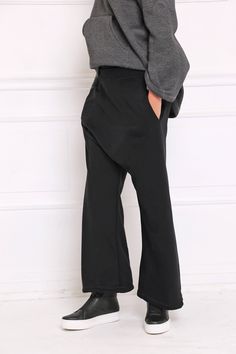 Women Black Pants, Drop Crotch Pants, Palazzo Pants Drop crotch sweatpants in wide leg: |KOMBO| GARMENT FEATURES: * Comfy, cosy, and easy to wear * Drop crotch silhouette * Wide leg fit * Elasticated waist * Practical side pockets * Made from quality sweatshirt cotton jersey COLOUR OPTIONS: This product is available in the following color options: - black; - graphite grey; - light grey; - navy; - white. SIZE & FIT: Model is 175cm tall and wears size S. COMPOSITION: Main: 100% cotton GARMENT Stretch Wide Leg Straight Pants For Streetwear, Stretch Wide-leg Pants For Streetwear, Black Stretch Wide-leg Yoga Pants, Black Yoga Pants For Fall, Black Wide-leg Sweatpants, Black Relaxed Fit Wide-leg Yoga Pants, Black Baggy Wide-leg Sweatpants, Black Straight Harem Pants For Streetwear, Black Relaxed Fit Yoga Trousers