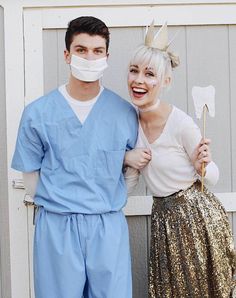 a man and woman dressed up as dentists posing for the camera with their mouths open