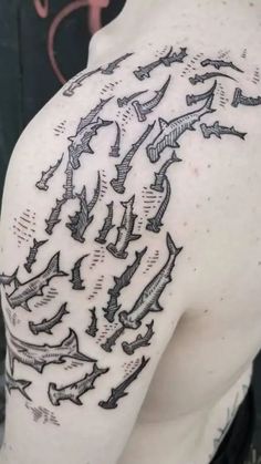 the back of a man's shoulder with many arrows on it