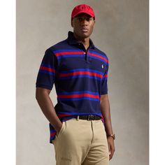 An American style standard since 1972 the Polo shirt has been imitated but never matched. Over the decades Ralph Lauren has reimagined his signature style in a wide array of colors and fits yet all retain the quality and attention to detail of the iconic original. This Big & Tall version is made with our highly breathable cotton mesh which offers a textured look and a soft feel. It features a classic striped pattern along with our signature embroidered Pony. Casual Blue Shirt With Signature Stripes, Casual Collared Tops With Signature Stripes, Casual Red Top With Signature Stripes, Casual Polo Collar Top With Signature Stripes, Classic Striped Relaxed Fit Polo Shirt, Classic Fitted Tops With Signature Stripes, Casual Cotton Shirt With Signature Stripes, Fitted Cotton Tops With Signature Stripes, Red Cotton Tops With Signature Stripes