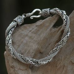 Braids of textured silver intertwine in a beautiful braided bracelet from Komang Wijayana. Crafted by hand, this opulent design takes its name from the sanca batik, or mighty python. .925 Sterling silver