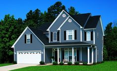 a blue house with white trim and windows