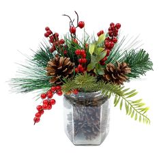 a vase filled with pine cones and berries