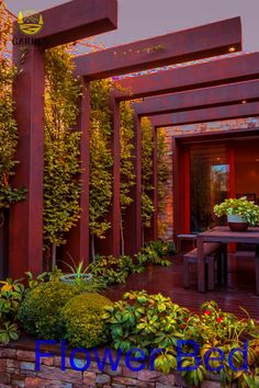 an outdoor dining area with plants and flowers