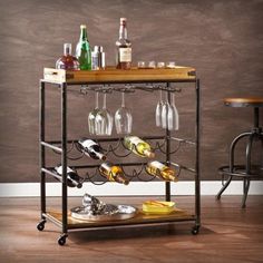 a bar cart with wine glasses and bottles on it