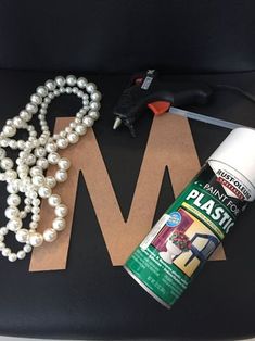 some crafting supplies are laying out on the seat belt, including glue and pearls