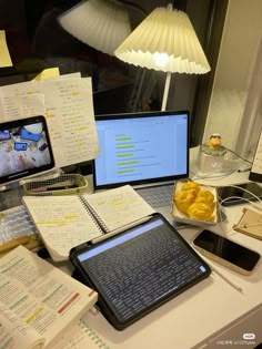 a laptop computer sitting on top of a desk