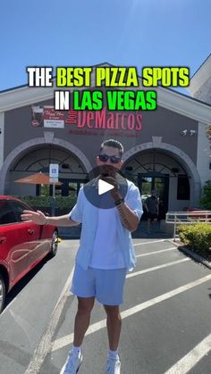 a man standing in front of a pizza shop with his hand out to the camera