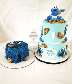 two cakes made to look like sesame street characters, one is blue and the other is white