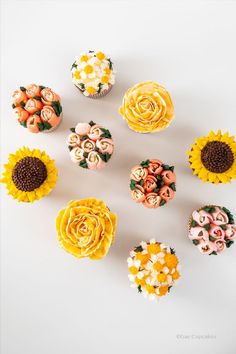 Vanilla cupcakes with assorted buttercream flowers on top such as chamomile, roses, sunflowers, and tulips. Party Cupcakes, Cupcake Party, Cup Cakes, Edible Flowers, Real Flowers