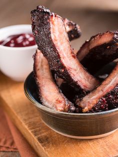 some meat is sitting in a bowl on a table