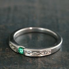 Men's Engagement Ring Celtic Band Emerald Ring Men's Celtic Band Women's Celtic Wedding Ring Celtic Knot Ring Irish Wedding Band Silver This simple Celtic Band reaches a new level with a 3mm channel set round emerald! The band itself is solid Sterling Silver and measures 3mm at the front, tapering to just over 2mm in the back, making it a very comfortable to wear band. It is a chunky 3mm thick in the front and thins to 1.5mm thick in the back. The Celtic knotwork relief carvings accent the stone Wedding Band Silver, Celtic Band, Rutilated Quartz Ring, Celtic Knot Ring, Celtic Wedding Rings, Celtic Knotwork, Celtic Wedding, Celtic Rings, Irish Wedding