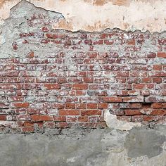 an old brick wall with peeling paint on it