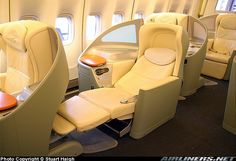 the inside of an airplane with many seats