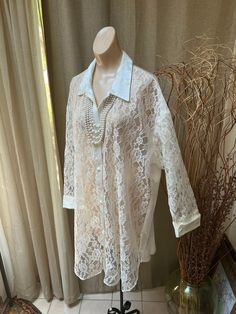 "Pretty white lace and satin night gown or button down robe from Victoria's Secret in perfect condition and never worn. Size tag says M/L but I think it is closer to a size L or XL. This would look very pretty worn over one of Victoria's Secret sleek slip style night gowns, even a long one. Also just right over a silky pajama top and shorts or as a top for your drawstring satiny pants. White satin collar, French cuffs and buttons down the front. Satin in back. Curved at the sides. 35\" length 48 Elegant Lace Chemise For Daywear, Sheer Lace Chemise For Summer, Feminine Lace Chemise For Daywear, Spring Lace Chemise For Wedding Night, Lace Chemise For Wedding Night In Spring, Spring Wedding Night Lace Chemise, Sheer Lace Blouse For Daywear, Elegant Lace Top For Beach, Elegant Lace Wedding Chemise