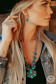 Add a touch of wild west flair to your outfit with the Stagecoach Trails necklace and earring set. Featuring three exquisite faux turquoise stones and a playful concho charm, this set is a must-have for any cowgirl looking to make a statement. Giddy up and get yours today!