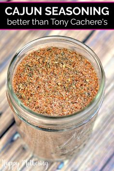 a jar filled with spices sitting on top of a wooden table