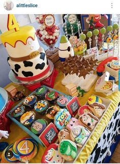 a table topped with lots of cakes and cupcakes