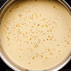 a pan filled with food sitting on top of a stove