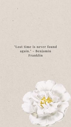 a white flower with the words, lost time is never found again - benjamin franklin