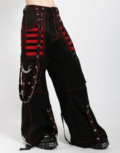 Black and Red ~ pants zip off into shorts and feature removable chains, adjustable ankles, D-rings, and deep, netted pockets. WOMAN IS WEARING X-SMALLMAN IS WEARING MEDIUMSIZING BASED ON MENS FIT– Refer to Unisex Darkstreet Pant - Size Chart (Based on Men's Sizing)– Drawstring and adjustable waist buckles allow for a tighter fit on the waist– 100% Cotton.– Hand wash cold. Lay flat to dry. Black And Red Pants, Alt Style Outfit, Skull Pants, Tripp Pants, Custom Leather Jackets, Strap Pants, Emo Outfits, Tripp Nyc, Red Pants