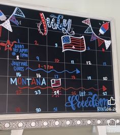 a blackboard with red, white and blue writing on it that says city calendar